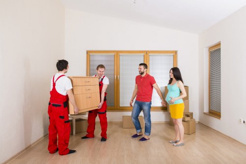 Household items and boxes being transported by a local moving van