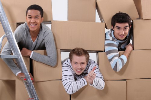 Residential moving truck helping with boxes and appliances