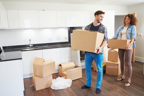Moving boxes and household items ready for transport in Cannhall