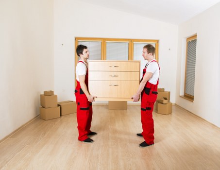 Staff assessing a property access route before loading items
